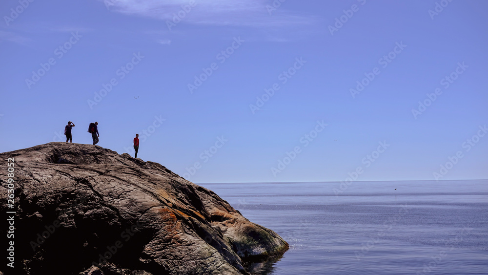 People by the ocean bed - Clear sky - Norway People by the ocean bed - Clear sky - Norway