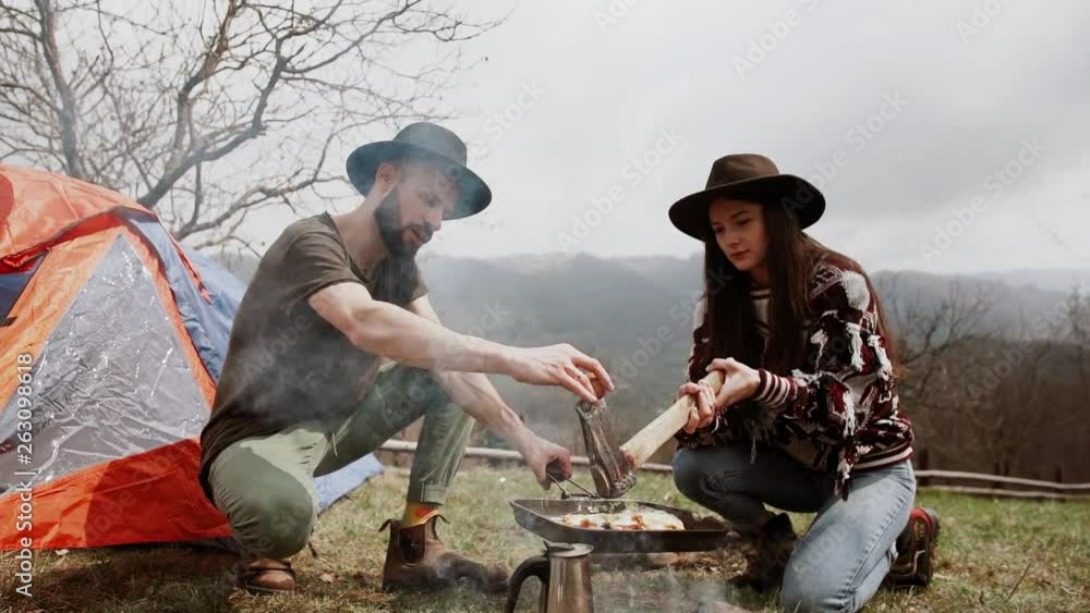 Happy young couple traveling in the mountains Happy young couple traveling in the mountains
