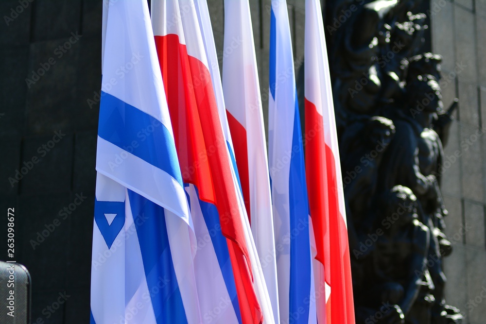 Poland and Israel flag waving in the wind. Israel and Poland two flags textile cloth.
