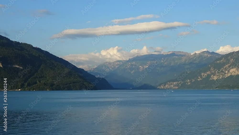 Timelapse view lake Thun (Thunersee) and mountains of Swiss Alps in city Spiez, Switzerland, Europe. Summer landscape, sunshine weather, blue sky and sunny day Timelapse view lake Thun (Thunersee) and mountains of Swiss Alps in city Spiez, Switzerland, Europe. Summer landscape, sunshine weather, blue sky and sunny day
