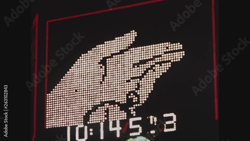 NEW YORK CITY, 1971, Times Square at night, flashing neon signs, animated watch sign with running clock