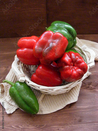 Vegetables background : fresh bell pepper on wooden table vertical photo