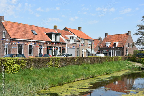 Street in village in Holland with 'Koningsdag' decoration.