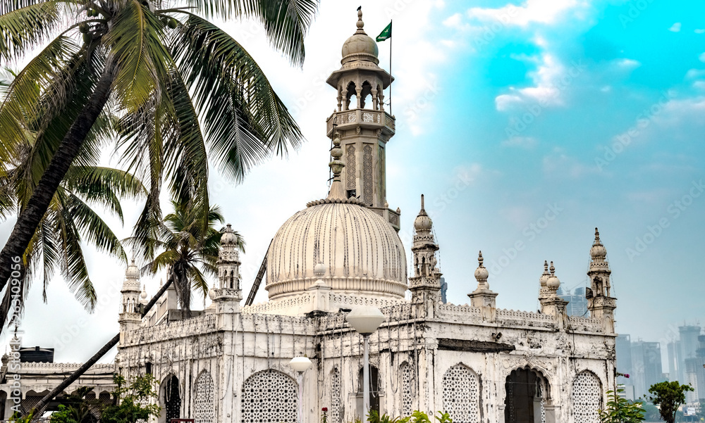 Famous Sufi Shrine of Pir Haji Ali Shah Bukhari known as Haji Ali Dargah. Made up of Marble in typical Indo-Islamic architecture, this shrine, a tourist spot is situated off the Worli Coast in Mumbai