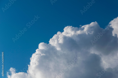 white fluffy clouds in blue sky