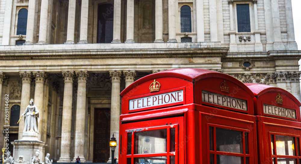 Close up on red phone boxes and Saint Paul's Cathedral in London in the background Close up on red phone boxes and Saint Paul's Cathedral in London in the background