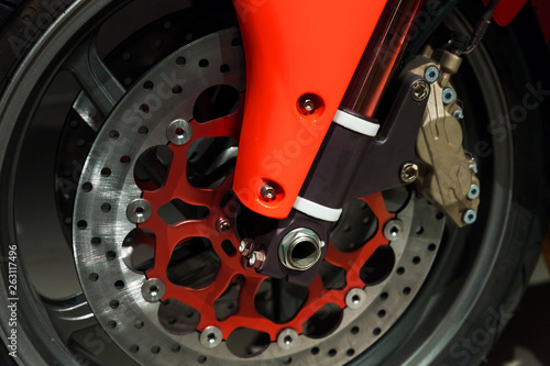 Motorcycle wheel fragment with red parts