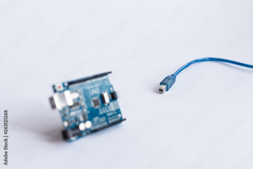 Arduino Uno. Micro controller. Technology. Electronic computing machine. Concept. High intelligence. STEM education for children and teenagers, robotics and electronics. DIY. AI. Arduino Uno. Micro controller. Technology. Electronic computing machine. Concept. High intelligence. STEM education for children and teenagers, robotics and electronics. DIY. AI.