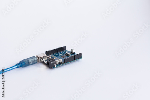 TERNOPIL, UKRAINE - APRIL 19, 2019: Arduino Uno. Micro controller. Technology. Development platform connected to PC with a USB cable. Electronic computing machine. Concept. High intelligence.
