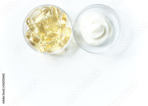 Creation of cosmetics, ingredients. Vitamins in cream, emulsion, Elixir of youth. Ampoules, jars with pipette dispenser on a white background. 