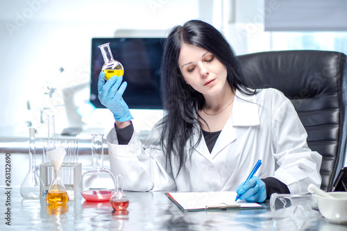 Chemical laboratory. Woman ...