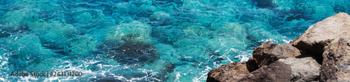 Clean blue turquoise sea and rocks 