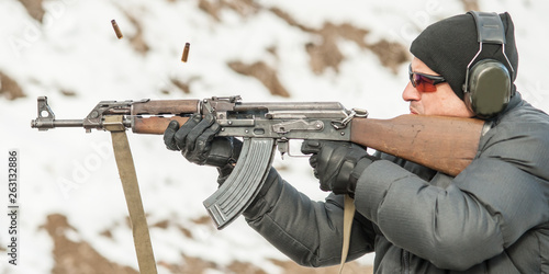 Civilian shooting training from rifle machine gun on shooting range photo