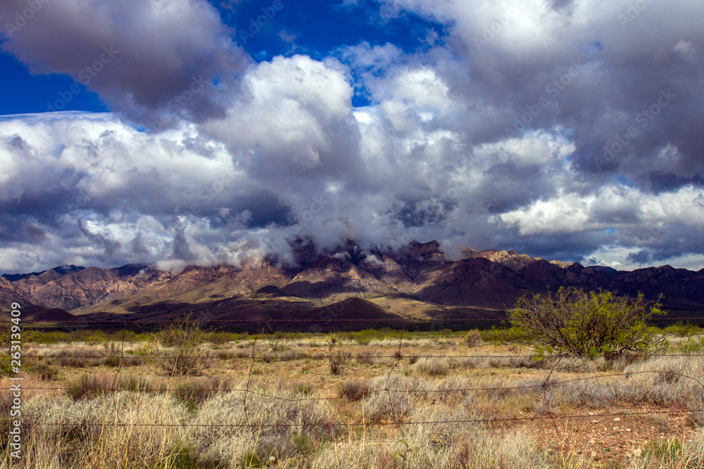 Storm clouds gather over Chiricahua Mountains near the town of Portal, Arizona