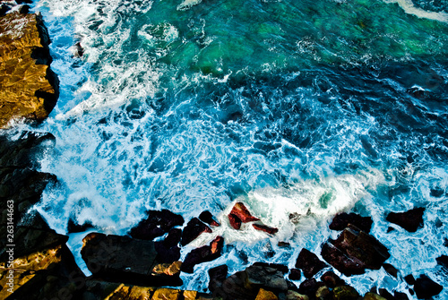 The Shadow of the Sea cliff Bridge casting a shadow on to the rocks and sea of the Illawarra Coastline, NSW, Australia