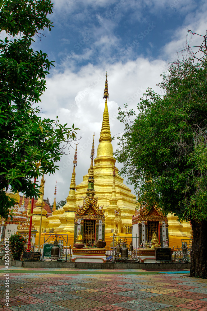 Image of golden pagoda is located in the temple in bantak District. Buddhist temple in Thailand.