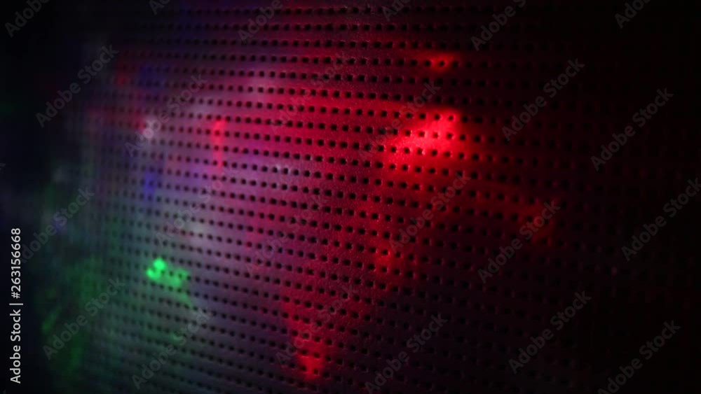 Red green gray and blue glow on a dark background in a black dot Red green gray and blue glow on a dark background in a black dot