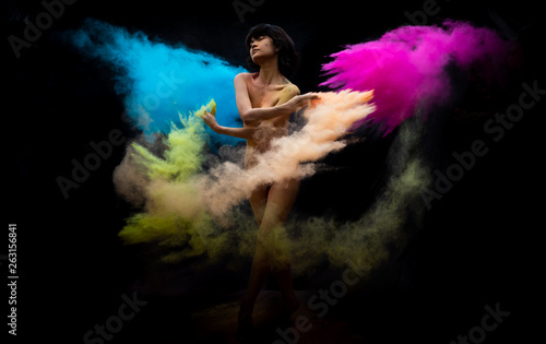 model Asian girl emotion posing and movement with dust color on dark background