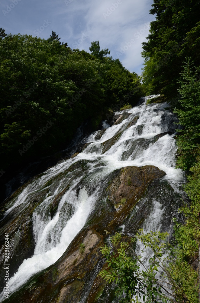 Yudaki Falls, famous waterfall in Nikko region, Japan. Gushing out gallons of water per second down a steep vertical cliff, Yudaki Falls is one of Nikko's top natural wonders. Yudaki Falls, famous waterfall in Nikko region, Japan. Gushing out gallons of water per second down a steep vertical cliff, Yudaki Falls is one of Nikko's top natural wonders.