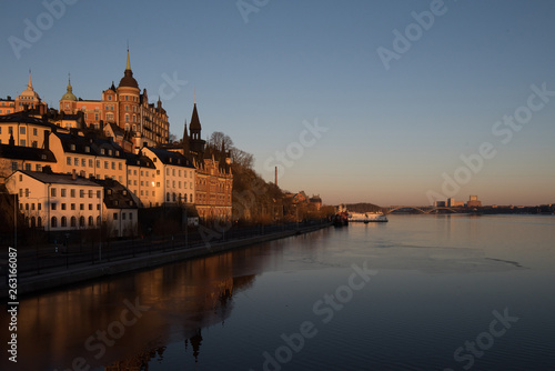 View over old houses in the S  dermalm district a spring day at sunrise in Stockholm from the Riddarholmen island