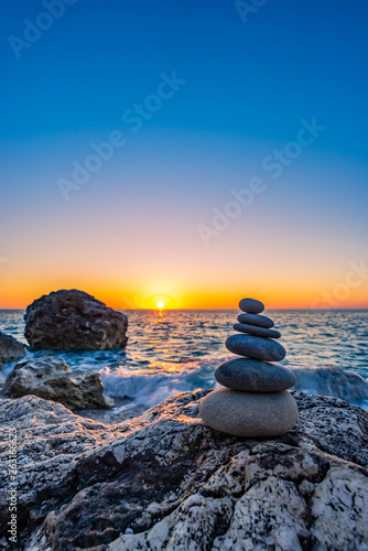 Canvas Print Stacked stones at the beach
