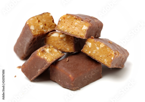 Chocolate peanut candy on white background