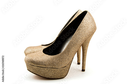 An isolated pair of Gold Stiletto Heals