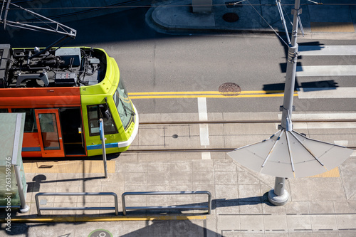 Portland streetcar stands at the tram stop waiting for passengers to continue along the route