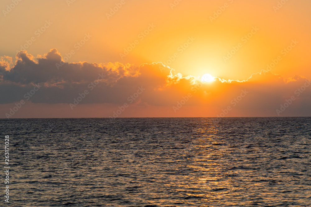 Naklejka premium Colorful dawn over the sea, Sunset. Beautiful magic sunset over the sea