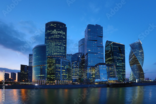 Moscow/ Russia April 19 2019: The unique skyscraper of Moscow city, the modern office center in the heart of capital of Russia in the evening in the rays of setting sun on the bank of Moskva river