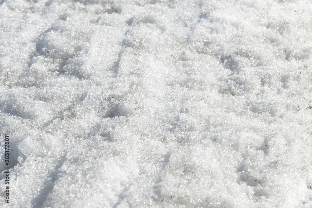 Obraz premium Abstract snow texture. Early spring snow background close up