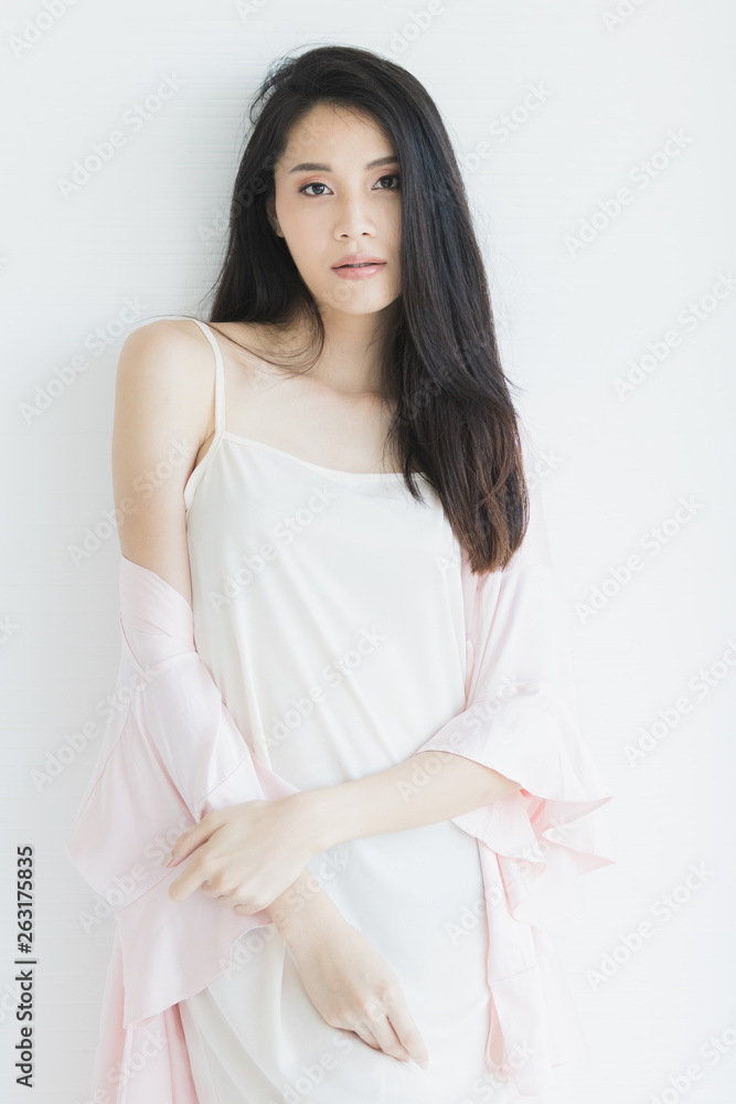 Sexy woman in pajamas posing in seductive mood.. Sexy woman in pajamas posing in seductive mood..