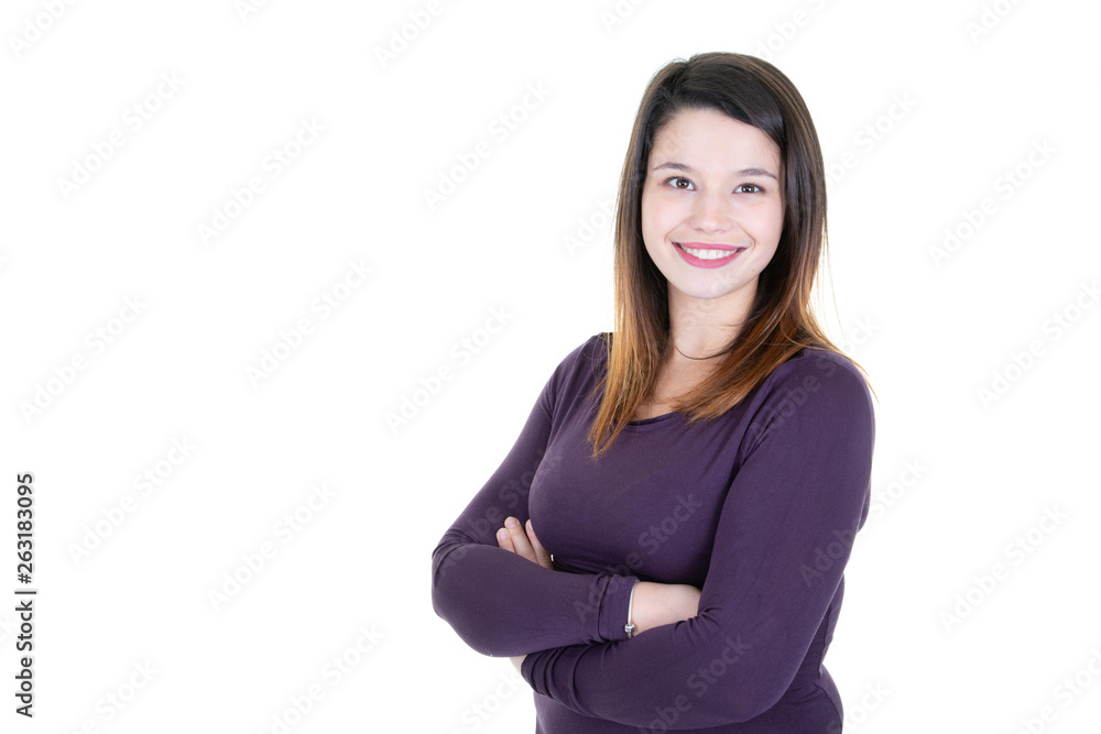 Smiling young brunette woman with crossed arms looking at the camera with white blank copy space Smiling young brunette woman with crossed arms looking at the camera with white blank copy space