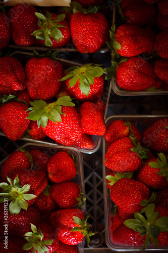 Fresh strawberry in plastic box at market