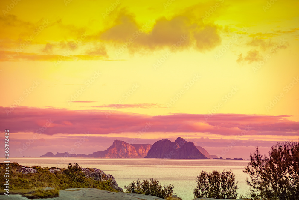 Island on the horizon. Rocks in the sea. Beautiful rocky seascape in the evening. Wildlife Norway, seascape