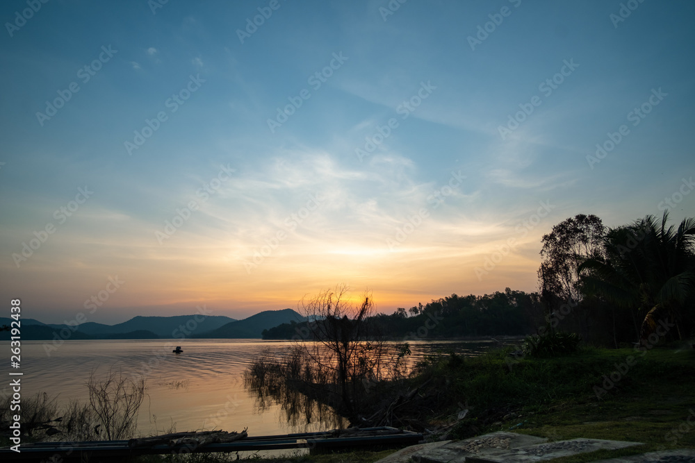 Sun rise in the morning with  dam and mountain.