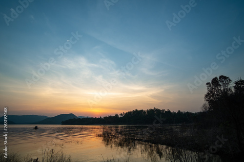 Sun rise in the morning with  dam and mountain.