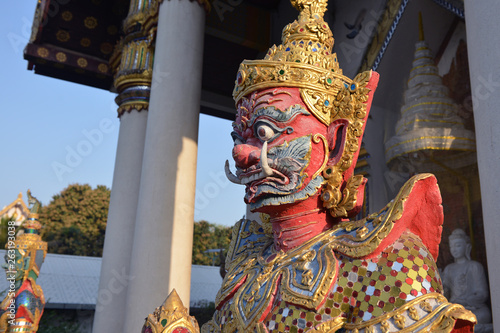 The Demon Guardian statue at the gate of the temple in Thailand. photo