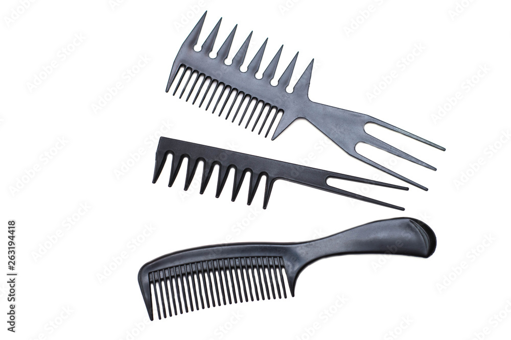 Plastic black hairbrushes on a white background - isolate Plastic black hairbrushes on a white background - isolate