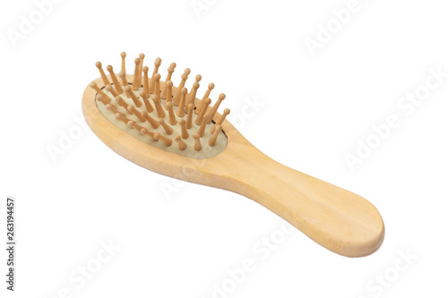 Wooden massage comb on a white background - isolate