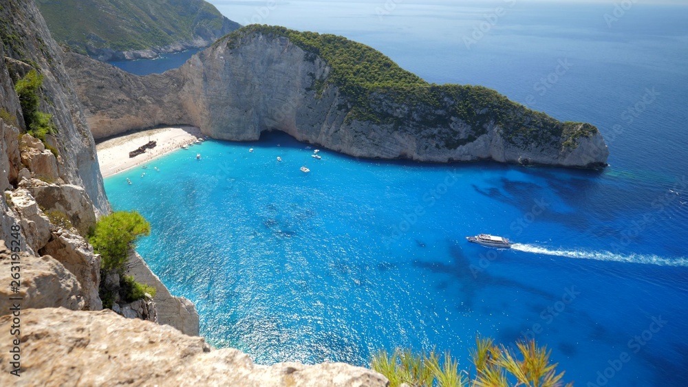Fototapeta premium Aerial top view panorama of Shipwreck Navagio beach of Zakynthos, Zante Mediterranean Island in Ionian Sea of Greece, the best beach of Europe
