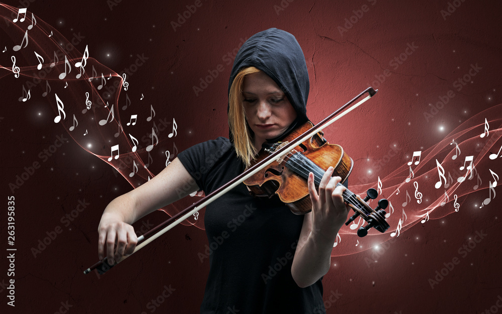 Fototapeta premium Lonely musical composer with violin and sparkling musical notes around