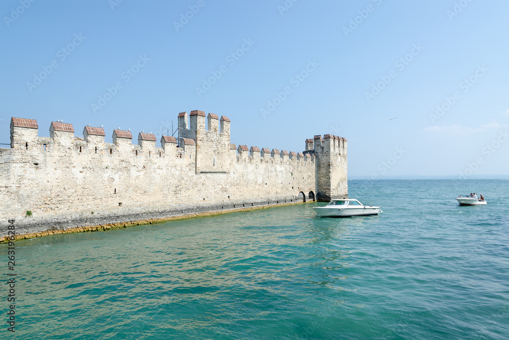Castle of Scaligers (second half of 12th - early 13th century) on shore of Lake Garda in resort town of Sirmione, Italy