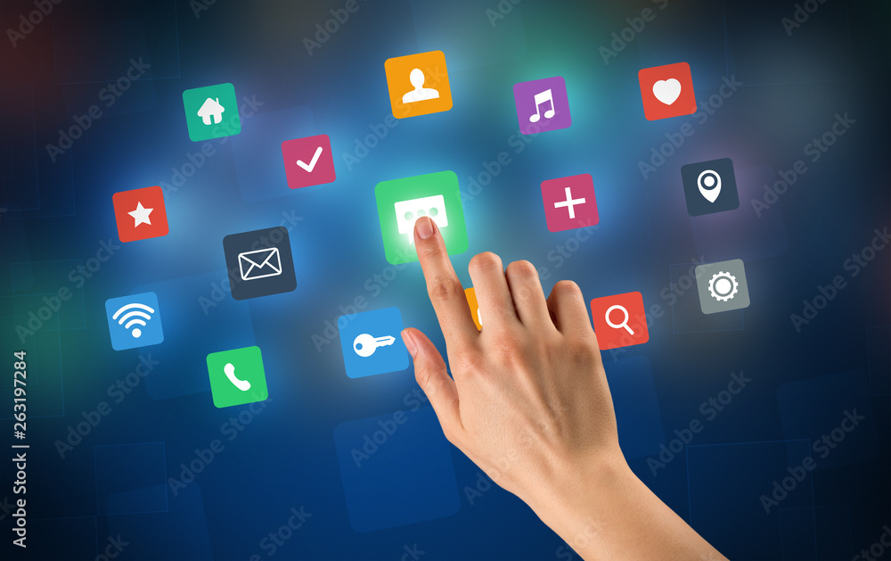 Female hand touching colorful applications Female hand touching colorful applications