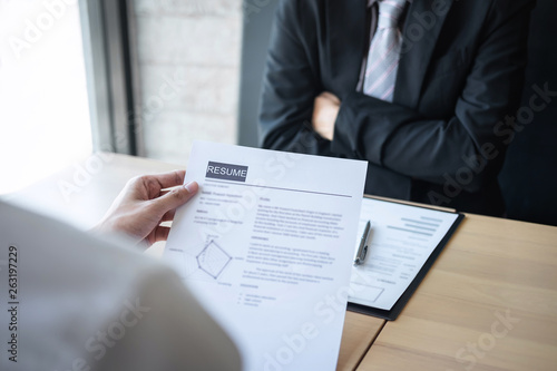 Employer arriving for a job interview, businessman listen to candidate answers explaining about his profile and colloquy dream job, manager sitting in job Interview talking in office