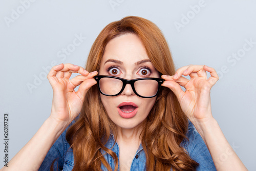 Close up photo beautiful amazing she her lady unbelievable big eyes teacher smart clever intelligent businesspeople assistant wear specs casual blue jeans denim shirt isolated grey background