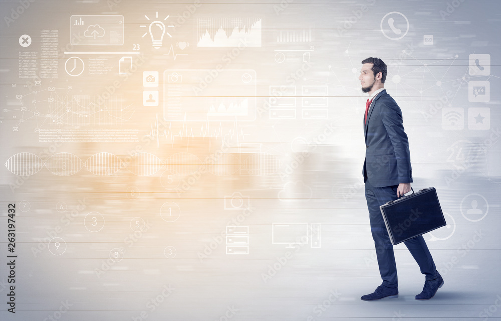 Handsome businessman walking in suit with briefcase on his hand and database concept around
Handsome businessman walking in suit with briefcase on his hand and database concept around