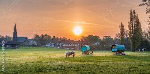 Romany Caravans with horse at sunrise in rustic village