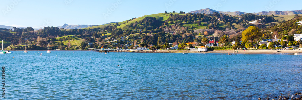 Panoramic photo of the harbourside in the French settlement town of Akaroa in the South Island of New Zealand.