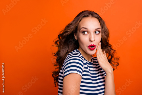 Closeup photo portrait of pretty sweet tender cute shy with opened mouth she her lady holding hand near cheek mouth looking aside isolated vivid vibrant background